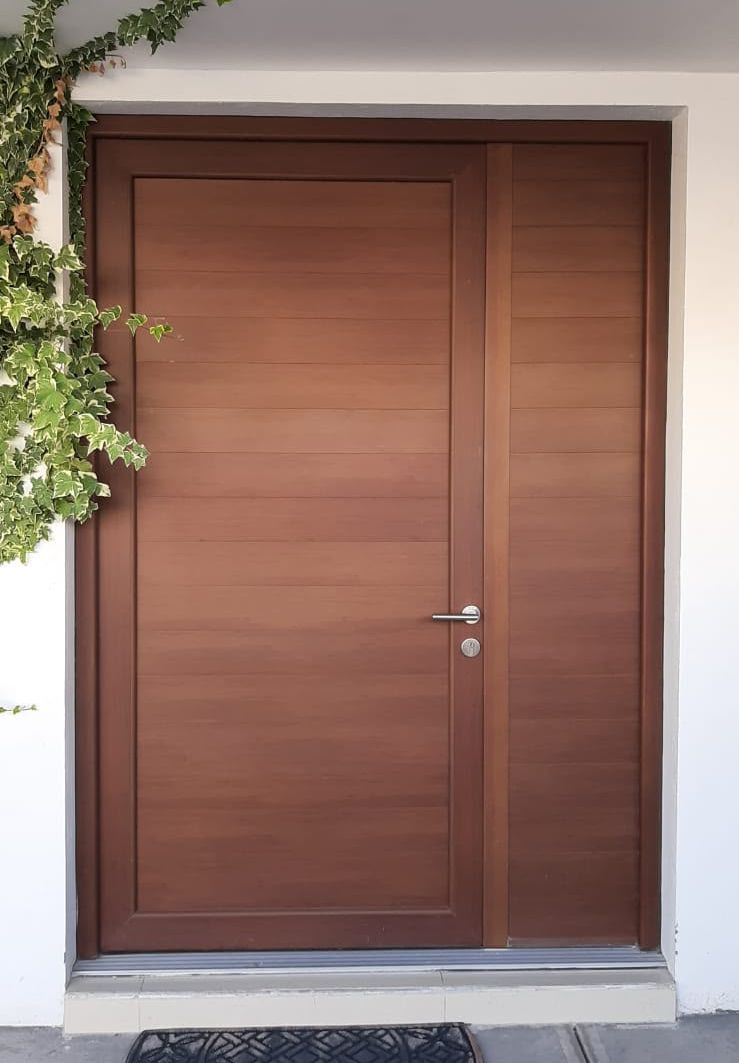 Modern wood-finish entry door with matching sidelight panel